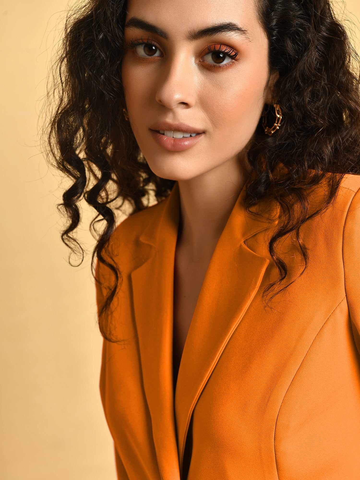 in a orange mood blazer